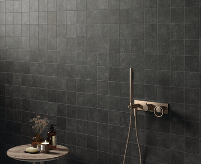 small black 100x100 matt tile on bathroom wall